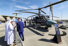 A Russian Kamov Ka-52E Alligator coaxial rotor military attack helicopter is pictured on the tarmac during the 2023 Dubai Airshow at Dubai World Central - Al-Maktoum International Airport in Dubai, United Arab Emirates on Nov. 13, 2023. 