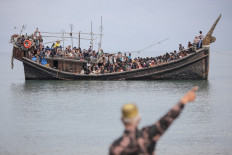 Fishermen rescue dozens of Rohingya after boat capsizes in Aceh