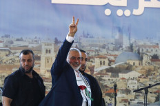 The Palestinian Hamas movement's leader Ismail Haniyeh flashes the victory sign following a speech at a public rally during his visit to the southern Lebanese city of Saida, on June 26, 2022. 