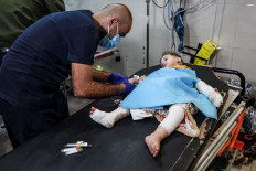 Injured Palestinians evacuated from the Indonesian hospital in the north of the Gaza Strip receive care at Nasser hospital in the Palestinian territory's southern city of Khan Yunis, on November 20, 2023, amid ongoing battles between Israel and the Palestinian Hamas movement. 
