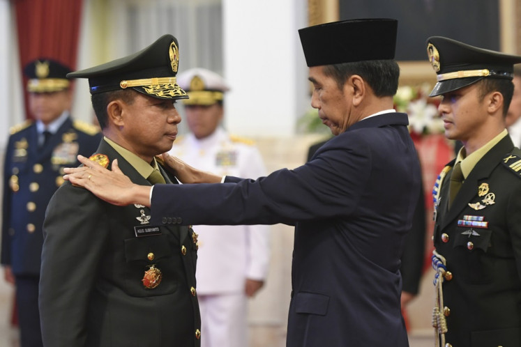 President Joko “Jokowi“ Widodo (center) inaugurates Army chief of staff Gen. Agus Subiyanto as the new Indonesian Military (TNI) commander at the State Palace in Jakarta on Nov. 22, 2023. Agus replaces the retiring Adm. Yudo Margono.