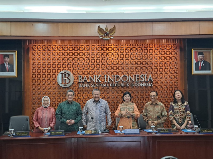 Bank Indonesia (BI) board of governors pose for a photo before the press in BI Jakarta headquarters on Nov. 11, 2023.