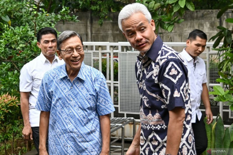 Presidential candidate Ganjar Pranowo (right) is received by former vice president Boediono at the latter’s private residence in Gondangdia, Central Jakarta, on Nov. 24, 2023.