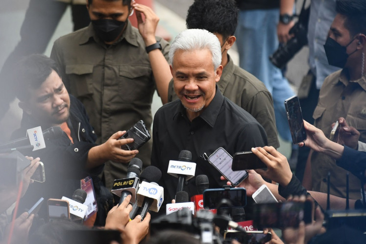 Presidential candidate Ganjar Pranowo (center) arrives at the General Elections Commission (KPU) headquarters in Jakarta ahead of the Peaceful 2024 Election Campaign Declaration launch on Nov. 27, 2023. 