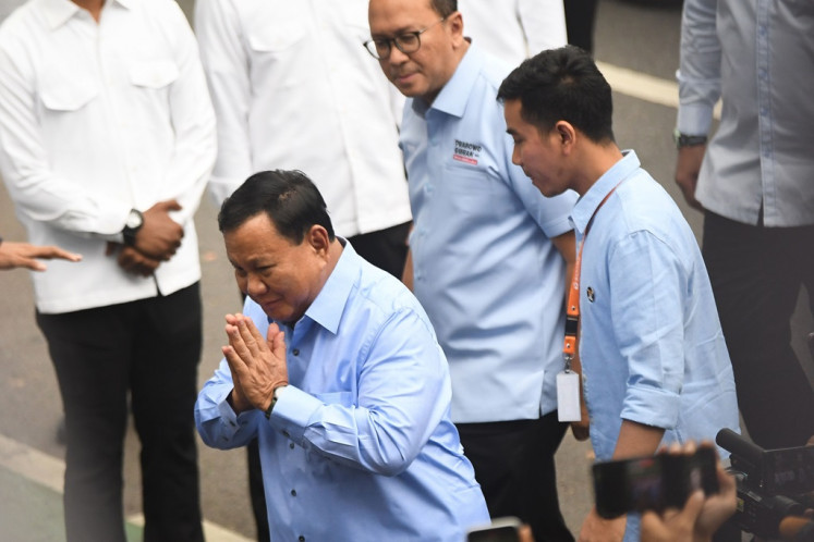 Presidential and vice presidential candidates Prabowo Subianto (left) and Gibran Rakabuming Raka (right) arrive at the General Elections Commission (KPU) headquarters in Jakarta ahead of the Peaceful 2024 Election Campaign Declaration launching event on Nov. 27, 2023. The declaration, signed by the six candidates as well as representatives of the 18 political parties participating in the 2024 election, calls for a safe, peaceful, orderly and ethical election.