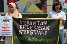 Women’s rights activists hold a banner reading “Eradicate sexual violence? There must be a way!” during a protest outside the Education and Culture Ministry in Jakarta on Feb. 10, 2020, against sexual harassment and violence against women on campuses.