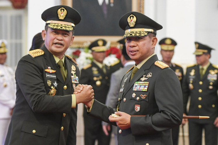 Indonesian Military (TNI) commander Gen. Agus Subiyanto (right) congratulates Gen. Maruli Simanjuntak following the latter's inauguration as Army chief-of-staff at the State Palace in Jakarta on Nov. 29, 2023. 