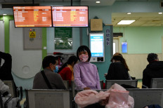 Children and their parents wait at an outpatient area at a children hospital in Beijing on Nov. 23, 2023. The World Health Organization asked China on the same day for more data on a respiratory illness spreading in the north of the country, urging people to take steps to reduce the risk of infection. China has reported an increase in “influenza-like illness“ since mid-October when compared with the same period in the previous three years, the WHO said.