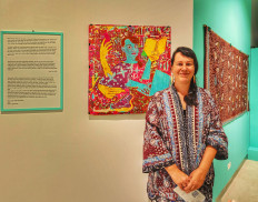 Batik guardian: Dutch artist and researcher Sabine Bolk stands in front of her batik self-portrait that she made earlier this year. Bolk is determined to keep up the spirit and skills, ensuring batik will always have a future.