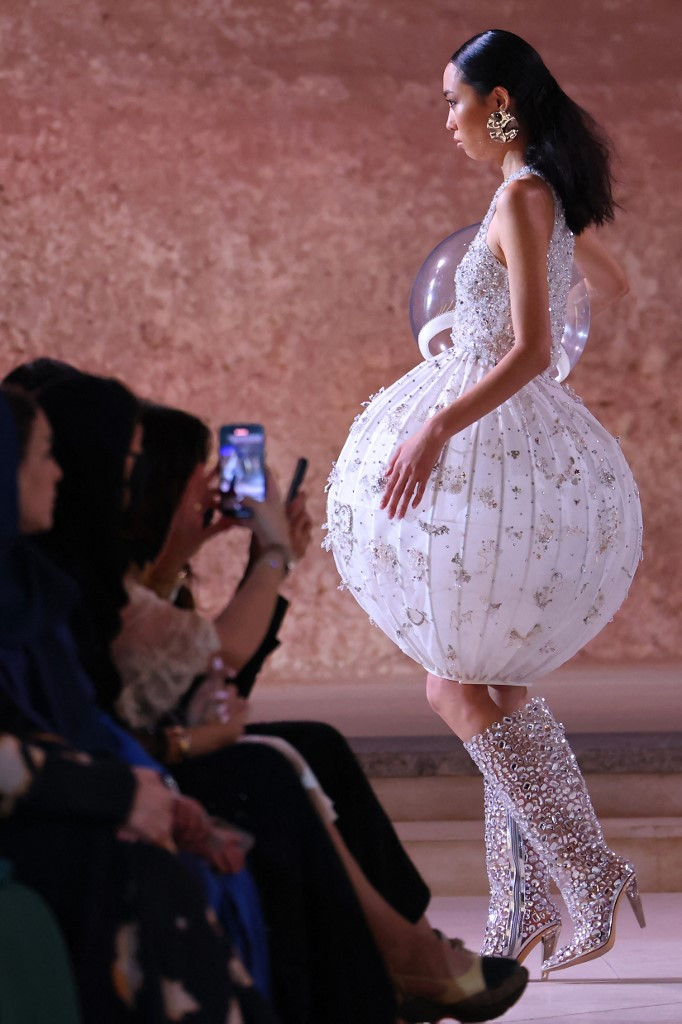 A model presents a creation by Saudi designer Honayda Serafi during Riyadh Fashion Week in King Abdullah Financial District KAFD in the capital Riyadh on Oct. 22, 2023.