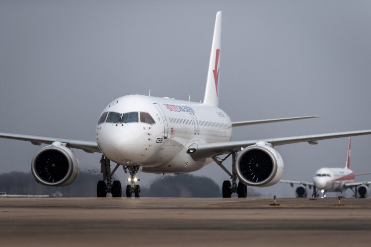 A Commercial Aircraft Corp of China (COMAC) C919 aircraft, China's first domestically produced large passenger jet, lands at Wuhan Tianhe International Airport during its verification flight in China's central Hubei province on January 16, 2023. 