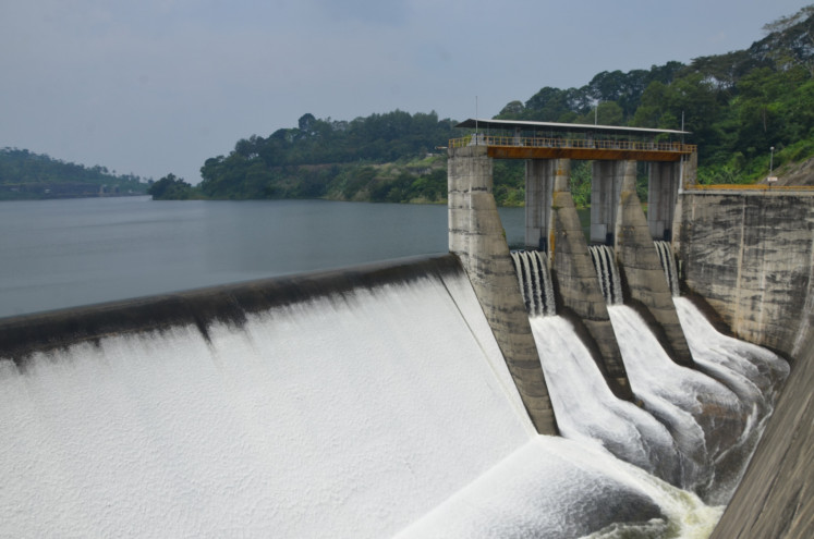 Water cascades down the watergate of the Saguling hydroelectric power plan in West Java. 