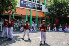 Students play on Nov. 2, 2023 at SD Kalicari 3 state elementary school in Semarang, Central Java.