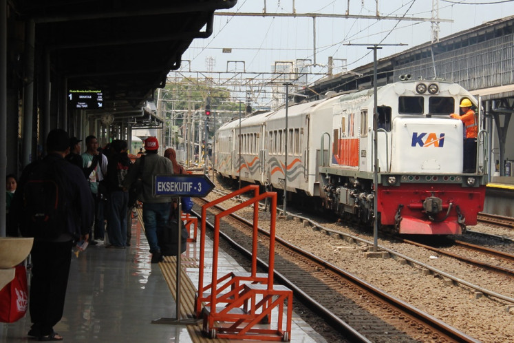 Passengers wait for an intercity train on Dec. 6, 2023, at Pasar Senen railway station in Central Jakarta.