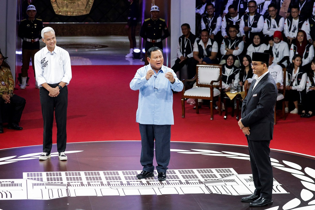 Presidential candidates (from left) Ganjar Pranowo of the Indonesian Democratic Party of Struggle (PDI-P), Defense Minister Prabowo Subianto and former Jakarta governor Anies Baswedan take part on Dec. 12, 2023 in the first televised election debate at the General Elections Commission (KPU) in Jakarta.