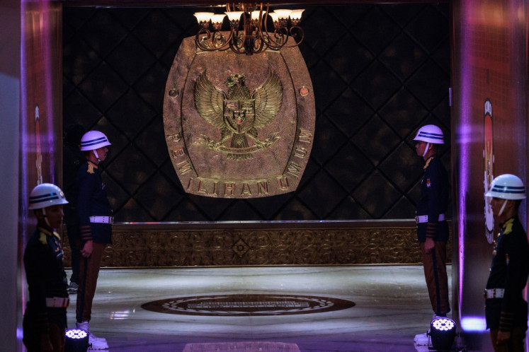 The emblem of the General Elections Commission (KPU) is pictured before the first presidential election debate at the commission's office in Jakarta on Dec. 12, 2023.