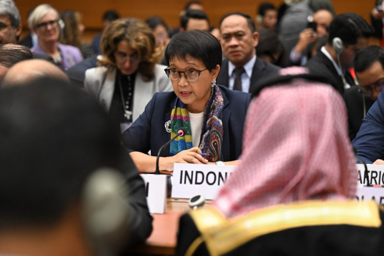 Foreign Minister Retno LP Marsudi (center) delivers a speech during a meeting on the situation in Gaza Strip on the sidelines of a ceremony marking the 75th anniversary of the Universal Declaration of Human Rights at the United Nations Offices in Geneva, on Dec. 12, 2023.