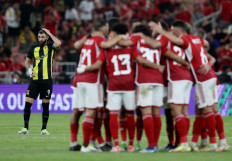 Al Ittihad player Karim Benzema stands on the background as players of Al Ahly gathers during a Club World Cup second round match at King Abdullah Sports City in Jeddah, Saudi Arabia on Dec. 15, 2023. 