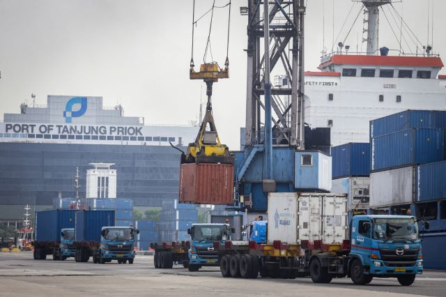 Trucks line up at Tanjung Priok container terminal in North Jakarta on Dec. 7, 2023, as ships are loaded and unloaded. 
