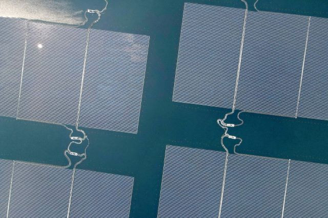 Floating power: This aerial photo shows the newly built floating solar power plant that can generate 192 megawatts (MW) of peak electricity in cooperation between the Indonesian government and state-owned renewable energy company Masdar of the United Arab Emirates, at the Cirata Reservoir, West Java. President Joko “Jokowi” Widodo inaugurated the plant on Nov. 9, 2023. 