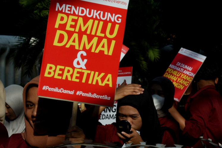 University students hold a protest at the General Elections Commission (KPU) office in Jakarta on Dec. 21, 2023. The protesters demanded that the 2024 elections be held peacefully and ethically.