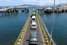 Bustling port: Vehicles line up to embark a ferry on Dec. 22, 2023, at Ketapang Port in Banyuwangi, East Java.