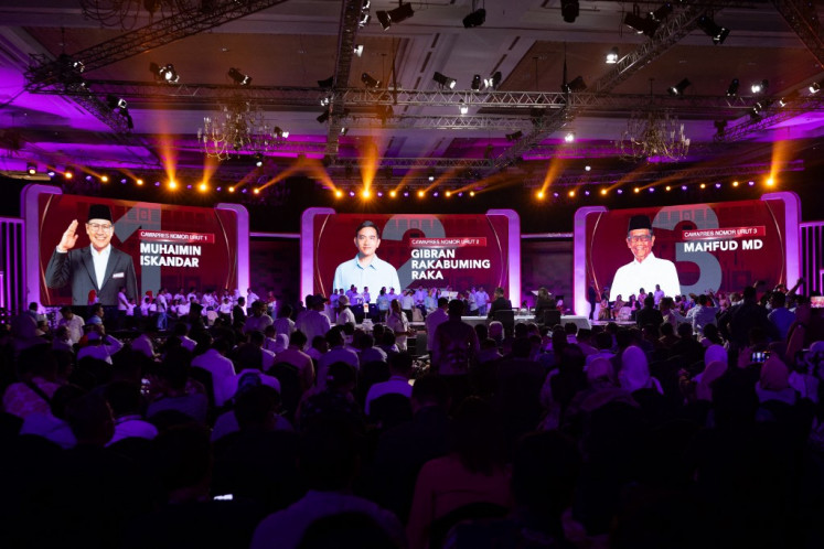 Portraits of vice presidential candidates Muhaimin Iskandar (left), Gibran Rakabuming Raka (center) and Mahfud MD are displayed on screens on Dec. 22, 2023, during the vice presidential debate at the Jakarta Convention Center in Jakarta. 