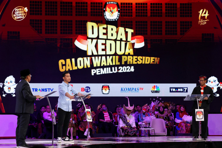 Vice presidential candidates Muhaimin Iskandar (left), Gibran Rakabuming Raka (center) and Mahfud MD attend a televised debate on Dec. 22, 2023, at the Jakarta Convention Center in Jakarta. 