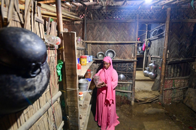 This photo taken on Nov. 26, 2023 shows Rohingya woman Nur Kayes at her house in the Nayapara refugee camp at Teknaf, in Bangladesh's southeastern district of Cox's Bazar. Rohingya refugees had hoped for a safe space at camps in Bangladesh after fleeing brutal violence in Myanmar but many of the persecuted ethnic minority are risking another dangerous sea crossing to escape hunger, kidnapping and gang violence.