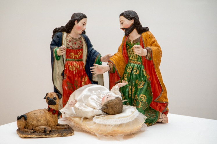 Figures depicting Jesus, Mary and Joseph, which form part of a series of figures representing biblical and everyday scenes from Colonial Quito, are seen during the assembly of the manger at the Del Carmen Alto Museum in Quito, on Dec. 14, 2023.