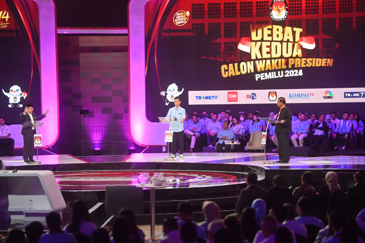 Vice presidential candidates Muhaimin Iskandar (right), Gibran Rakabuming Raka (center) and Mahfud MD attend the televised second 2024 election debate at the Jakarta Convention Center on Dec. 22, 2023. The debate covered issues related to the economy, finance, tax, investment, trade and infrastructure.