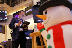 A trader works on the floor of the New York Stock Exchange in the United States during morning trading on Dec. 13, 2023, the day of the Federal Reserves final policy meeting of the year.