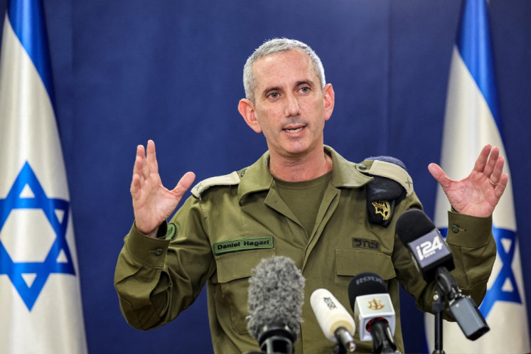 Israeli army spokesman Rear Admiral Daniel Hagari speaks to the press from The Kirya, which houses the Israeli Ministry of Defence, in Tel Aviv on October 18, 2023. 