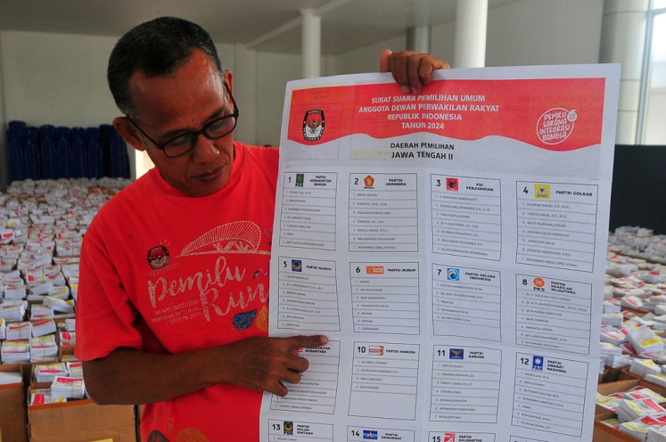 A General Elections Commission (KPU) official shows a damaged ballot paper at the ballot sorting center in Kudus, Central Java, on Dec. 29, 2023. The election organizer in Kudus found more than 4,000 damaged ballots ahead of the 2024 elections voting day, slated for Feb. 14, 2024. 