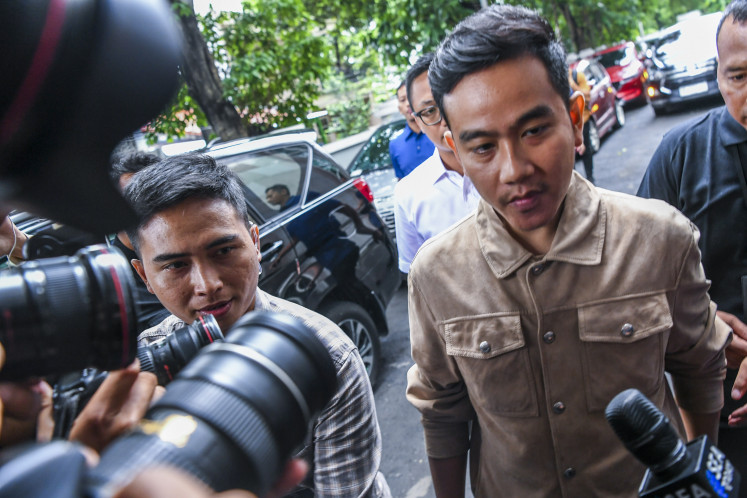 Vice presidential candidate Gibran Rakabuming Raka arrives at the Election Supervisory Agency (Bawaslu) office in Jakarta on Jan. 3, 2024, to clarify his suspected campaign activities during Car Free Day on Jl. Thamrin, Jakarta, on Dec. 3, 2023.