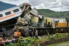 Search and rescue teams work at the scene of a train accident in Cicalengka, West Java, on Jan. 5, 2024. Three people were killed and at least 28 injured when two trains collided on Jan. 5, 2024, officials said.