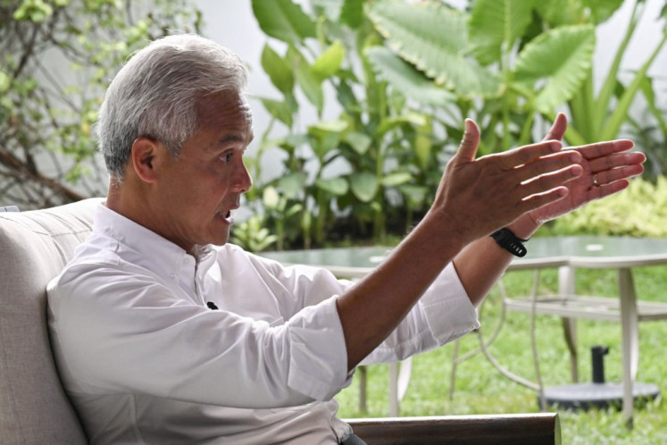 This picture taken on January 3, 2024 shows presidential candidate and former Central Java governor Ganjar Pranowo gesturing during an interview in Jakarta.