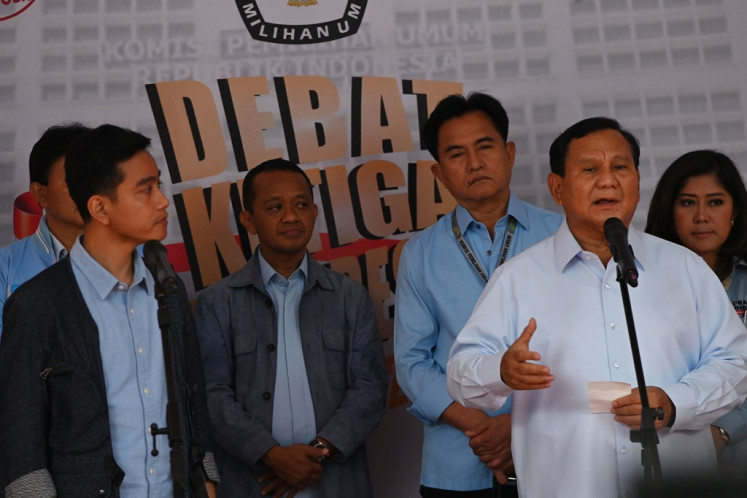 Presidential candidate pair Prabowo Subianto (right) and Gibran Rakabuming Raka (left) talk to the press on Jan. 7, 2024, after the third 2024 presidential election debate, at Istora Senayan in Jakarta. The third debate covered issues of international relations, defense and security. 