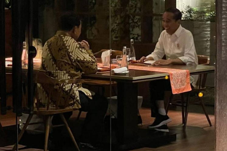 President Joko “Jokowi” Widodo (right) and Defense Minister Prabowo Subianto dine at a restaurant in Central Jakarta on Jan. 5, 2024. Jokowi has been accused of implicitly supporting the defense minister's presidential campaign by wielding his state authority and high approval ratings.