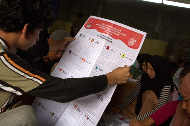 Workers check the quality of ballot papers for the 2024 legislative election on Jan. 9, 2024, at the Kendari Elections Commission (KPU) in Kendari, Southeast Sulawesi.