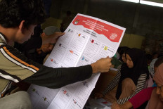 Workers check the quality of ballot papers for the 2024 legislative election on Jan. 9, 2024, at the Kendari Elections Commission (KPU) in Kendari, Southeast Sulawesi.