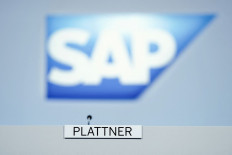 The logo and the plate with the name of the chairman of the Supervisory Board of German software group SAP Hasso Plattner is pictured at the beginning of SAP's annual general meeting, on May 18, 2022 in Walldorf, Germany.