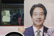 A poster of Taiwan's Vice President and presidential candidate of the ruling Democratic Progressive Party (DPP) Lai Ching-te is seen on a bus in Taipei on January 10, 2024. 