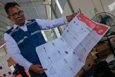 An official shows broken ballot papers on Jan. 11, 2024, at a General Elections Commission (KPU) warehouse in Pekalongan, Central Java.