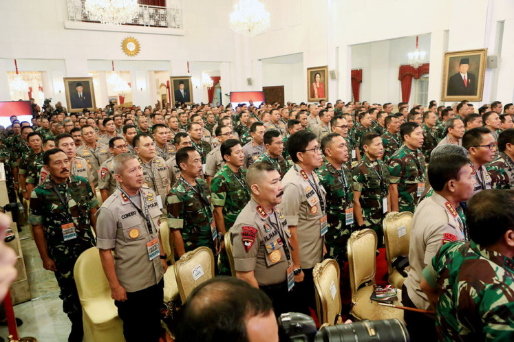 High-ranking officers of the Indonesian Military (TNI) and the National Police stand to attention at an annual meeting at the Presidential Palace. The meeting was attended by 198 TNI generals and 170 police generals. 