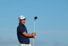 Tom Kim of South Korea plays his shot from the 13th tee during the final round of The Sentry at Plantation Course at Kapalua Golf Club on Jan. 7, 2024, in Kapalua, Hawaii, the United States.