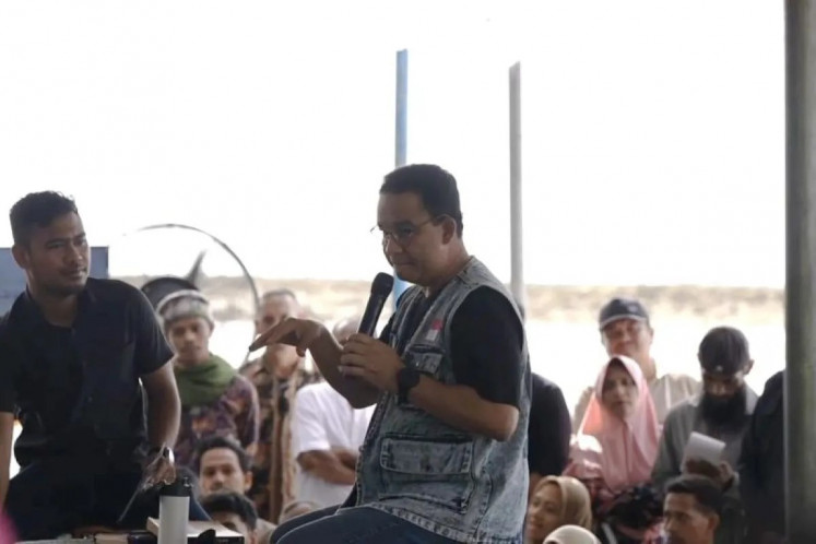 Presidential candidate Anies Baswedan talks to his supporters during a campaign event in Ambon, Maluku, on Monday, Jan. 15, 2024. Anies promised to build soccer pitches and hold regular competitions in Maluku to help nurture local talent. 