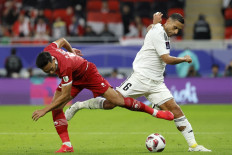 Iraq's defender #06 Ali Adnan fights for the ball with Indonesia's defender #05 Rizky Ridho during the Qatar 2023 AFC Asian Cup Group D football match between Indonesia and Iraq at the Ahmad bin Ali Stadium in Al-Rayyan, west of Doha on January 15, 2024. 