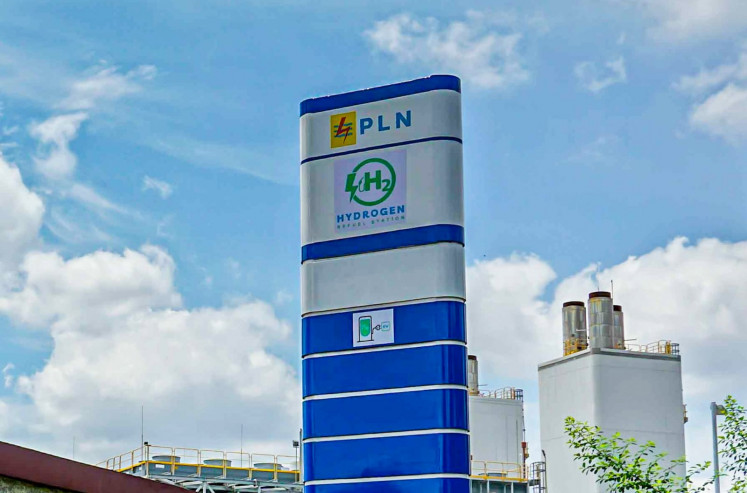 The sign for a hydrogen refueling station (HRS) stands against clear skies in Senayan Central Jakarta, in this undated handout photo from state electricity firm PLN.