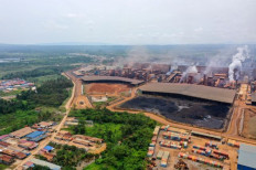 Smoke rises on Feb. 10, 2023 from a nickel smelter operated by Chinese miner Virtue Dragon Nickel Industry (VDNI) in Morosi, Southeast Sulawesi.